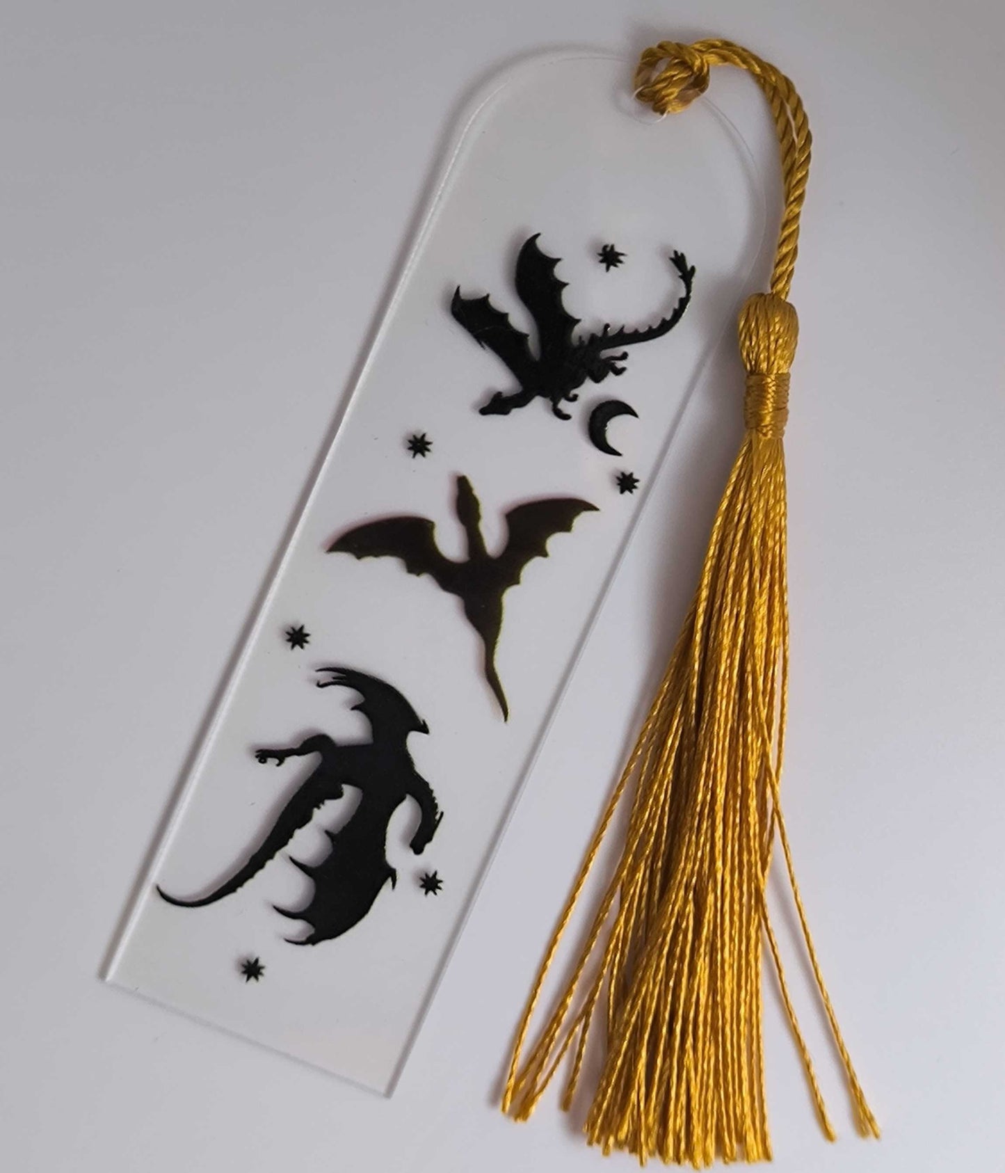 Акрилен книгоразделител „Драконови сенки“